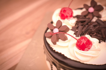 Birthday cake, vanilla Chocolate Cherry was divided pieces on a