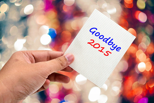 Goodbye 2015 handwriting on a sticky note
