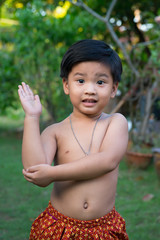 outdoor portrait of a little asian boy at the evening light.