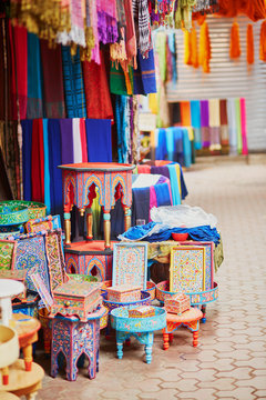 Selection of wooden furniture on a traditional Moroccan market