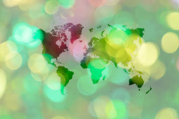 Abstract bokeh background of Christmas tree with world map