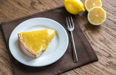 Slice of lemon tart on the plate