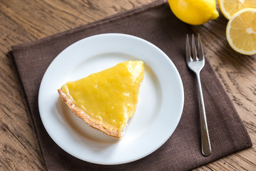 Slice of lemon tart on the plate
