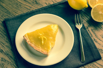 Slice of lemon tart on the plate