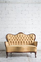 vintage sofa on white wall.