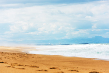 Fototapeta na wymiar Long Sand Atlantic Beach with ocean waves