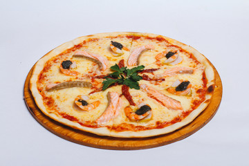 Seafood pizza isolated on white