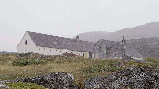 Old abandoned building during a snowfall in Hebron, Newfoundland and Labrador. Slow Motion