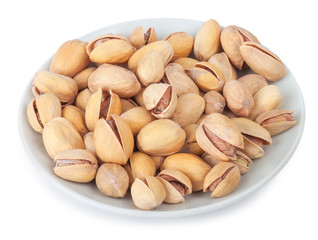 pistachios on white plate isolate