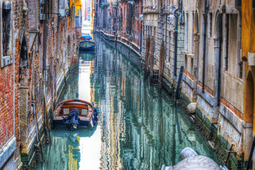 boats in a small canal in Venice