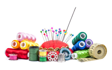 Composition with tailor threads isolated on white background