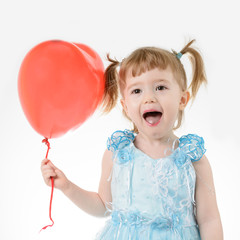 Obraz na płótnie Canvas Little girl in blue dress holding a balloon