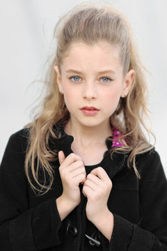 portrait of little girl outdoors in autumn