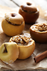 Baked apples on grey wooden table