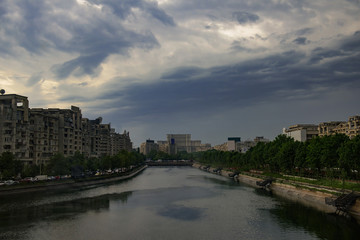 Bucharest, Romania - May 07, 2015: Bucharest skyline with Dimbovita river and Parliament Palace in front