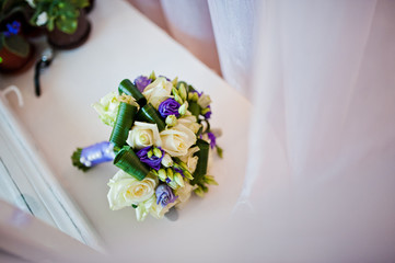 Purple and milk rose bouquet for the bride on her special day