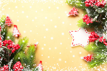 Christmas fir tree branches with toys on paper background