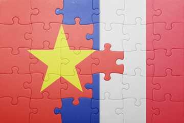 puzzle with the national flag of vietnam and france