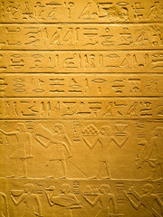 Ancient egyptian hieroglyph carved in sandstone