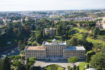 Fototapeta na wymiar Aerial view of the Vatican City and Rome, Italy. Palace of the Governorate, Gardens, Vatican Radio, Convent. Panorama of the old historical center. View from the roof of Saint Peter Basilica.