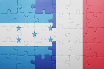 puzzle with the national flag of honduras and france