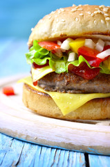 Homemade burger with meat cutlet,cheese and sweet pepper.