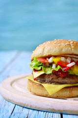 Homemade burger with meat cutlet,cheese and sweet pepper.
