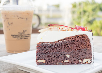 cake and ice coffee background on wood table