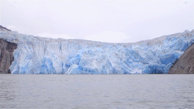 Slow motion shot of a glacier in Greenland.