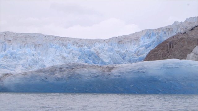 Slow motion shot of a glacier in Greenland.