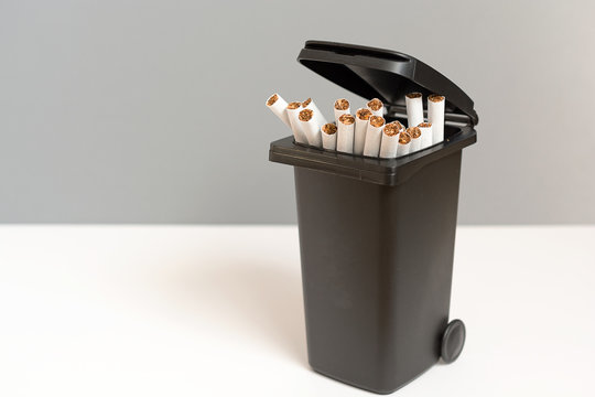 Bunch Of Cigarettes In The Trash Bin. Quit Smoking Concept