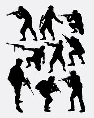 Fototapeta premium army soldier pose with gun weapon silhouette. Good use for symbol, web icon, game character, element, sign, mascot, or any design you want. Easy to use.