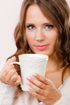 woman holding white mug with coffee warm beverage