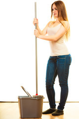Young cleaning woman with mop and bucket