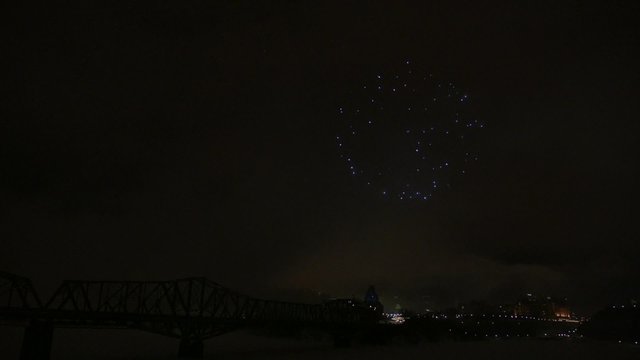 Slow motion fireworks over Alexandria Bridge crossing the Ottawa River during Winterlude.