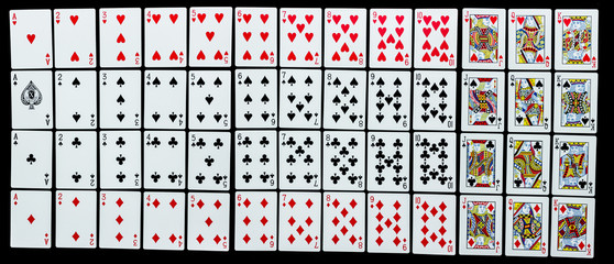 Poker set with isolated cards on black background