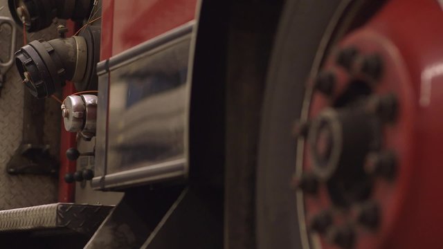 Hose hookup on a fire truck. Dolly Shot