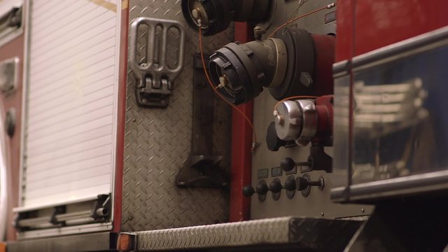 Hose hookups on a fire truck. Dolly Shot