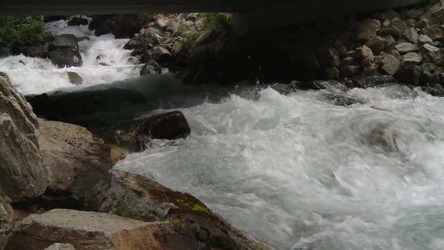 Stream flowing underneath a bridge in Bugaboo Provincial Park.