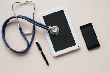 Obraz na płótnie Canvas Stethoscope in doctors desk