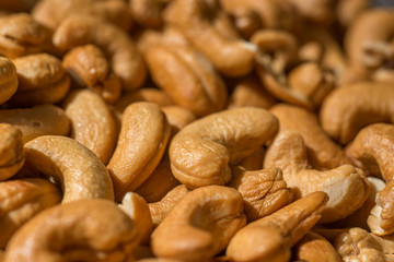 Freshly fried cashew nuts close up