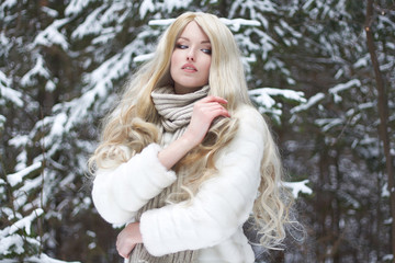 beautiful blond Woman in Fur Coat and scarf