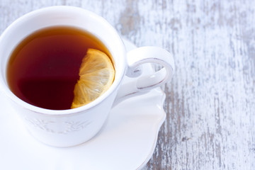 a cup of black tea with lemon