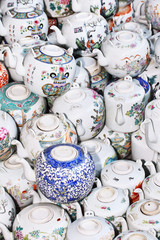 Fototapeta na wymiar Antique teapots on a flea market, Beijing, China