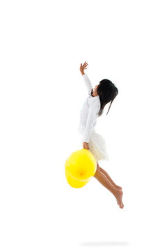 Motion Blur Asian Girl  Jumping And Holding Balloons On White Ba