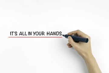 Hand with marker writing the text - It's All In Your Hands