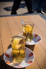Two traditional cups of Turkish tea (Chai) on a sunny table