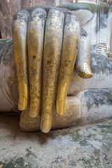 Hand of an ancient Buddha image at Sukhothai historical park, Th