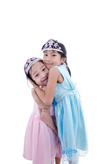 Cute two Asian little princess girls in silver crown and dress h