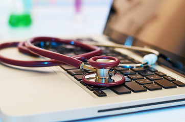 stethoscope on top of laptop in a lab
